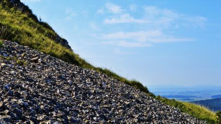 Rocky Slopes Under a Clear Blue Sky wallpaper