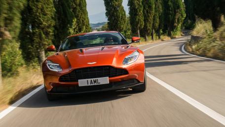 Sleek Aston Martin on a Scenic Drive wallpaper