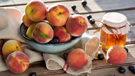 Fresh and Juicy Peaches on Wooden Table wallpaper