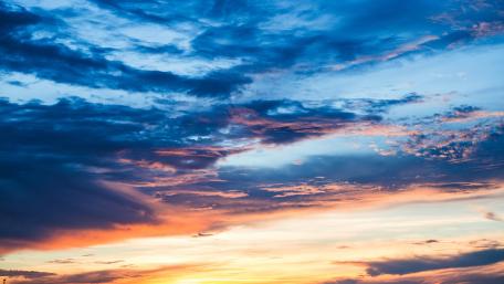 Vibrant Sunset Over Cloudy Sky wallpaper
