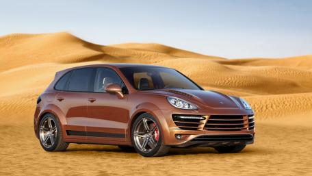 Sleek SUV Against a Desert Backdrop wallpaper