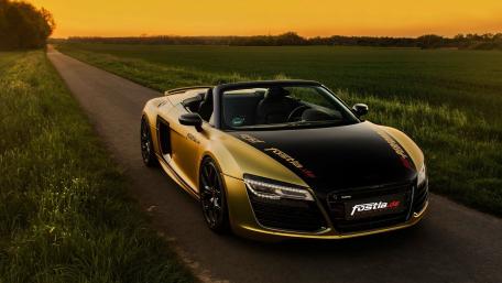 Sleek Luxury Convertible Under a Golden Sunset wallpaper