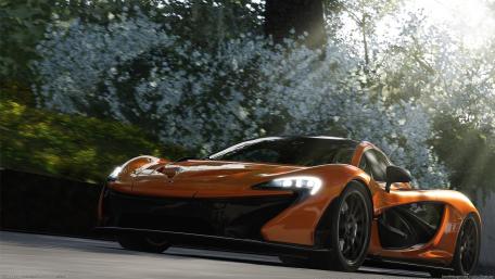 Sleek McLaren P1 on Scenic Driveway wallpaper