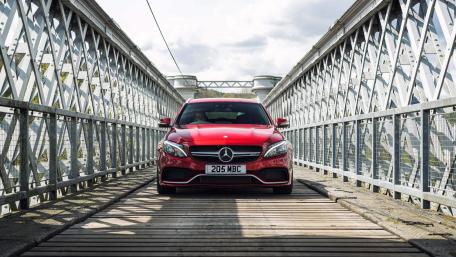 Stylish Red Mercedes on a Unique Bridge wallpaper