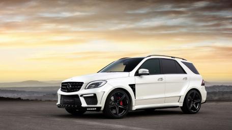 Sleek Luxury SUV Under a Dramatic Sky wallpaper