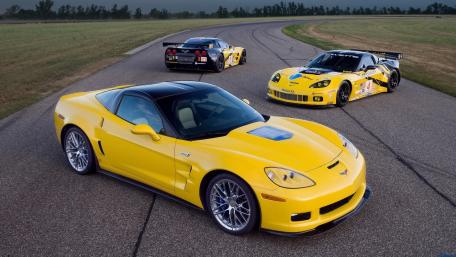 Vibrant Yellow Corvettes on the Track wallpaper
