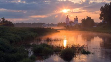 Serene Sunrise Over Tranquil River Scene wallpaper