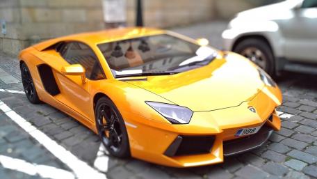 Vibrant Orange Lamborghini Aventador Wallpaper wallpaper