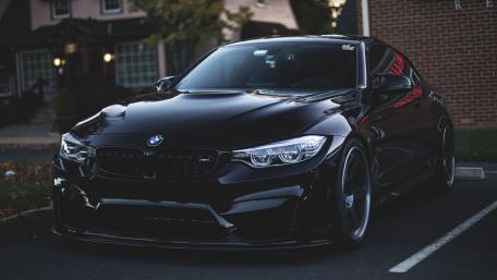 Sleek Black BMW M4 on Display wallpaper
