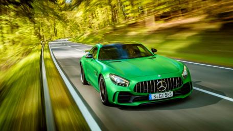 Sleek Green Mercedes GT R on a Scenic Road wallpaper