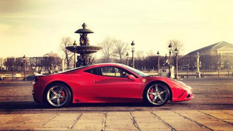 Red Ferrari in Stunning Urban Setting wallpaper