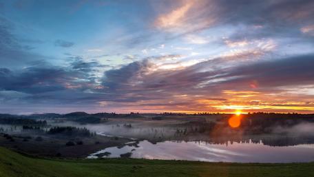 Serenity by the Misty Lake at Sunrise wallpaper