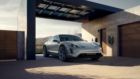 Sleek Electric Sports Car in a Modern Setting wallpaper