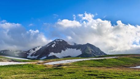 Majestic Mountain Landscape Under Clear Blue Skies wallpaper