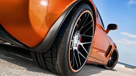 Sleek Orange Sports Car Wallpaper wallpaper