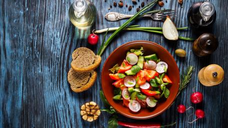 Fresh and Colorful Salad Preparation Scene wallpaper