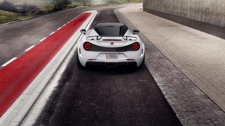 Sleek White Sports Car on Modern Road wallpaper