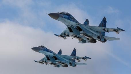 Fierce Duo of Fighter Jets in Action wallpaper