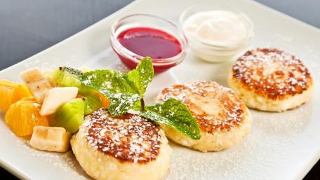 Delicious Pancakes with Fresh Fruit and Toppings wallpaper