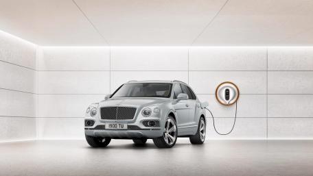 Sleek Electric SUV in Modern Setting wallpaper