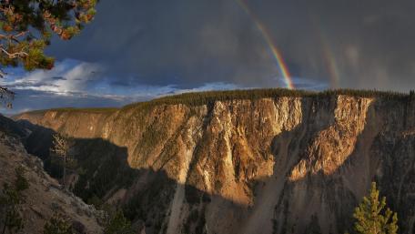 Majestic Rainbow Over Mountain Range wallpaper