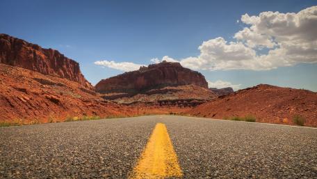 Endless Road Through Majestic Red Rocks wallpaper
