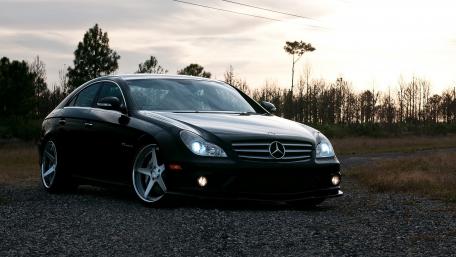 Sleek Black Mercedes in Golden Hour Glow wallpaper
