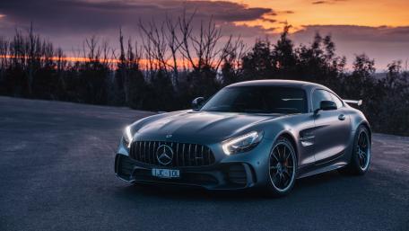 Sleek Performance Under Sunset Glow wallpaper