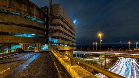 Urban Nightscape with Dynamic Light Trails wallpaper