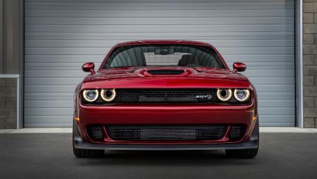 Sleek Red Muscle Car Wallpaper wallpaper