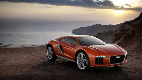 Sleek Audi Car Against a Stunning Sunset Background wallpaper