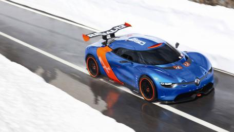 Sleek Blue Renault Racing on Snowy Roads wallpaper