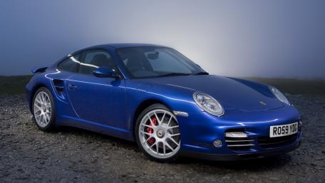 Sleek Blue Porsche Turbo in Foggy Serenity wallpaper