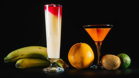 Refreshing Fruit Cocktails and Delicious Fruits Displayed Together wallpaper