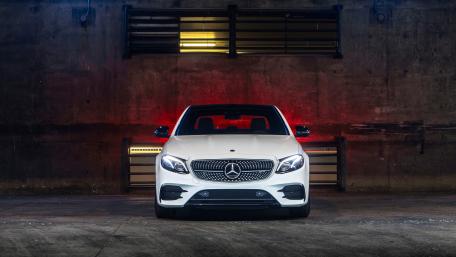 Sleek White Mercedes in Urban Setting wallpaper