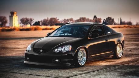 Sleek Black Acura in Sunset Glow wallpaper