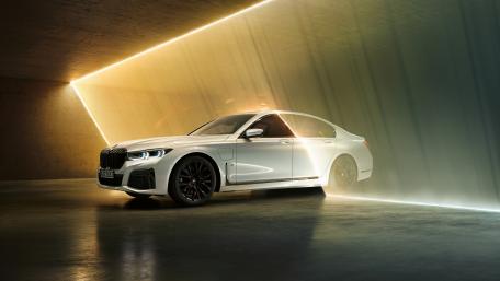 Sleek Luxury Car in Modern Setting wallpaper