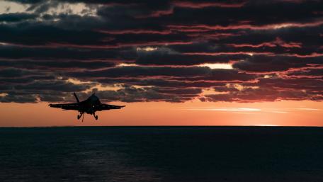 Jet in the Sky at Sunset Over Water wallpaper