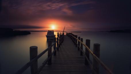Serene Pier Under Purple Dusk Glow wallpaper