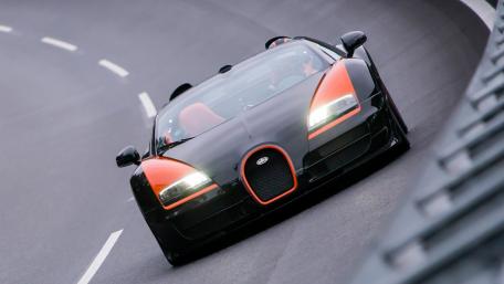 Sleek Black and Orange Sports Car Wallpaper wallpaper