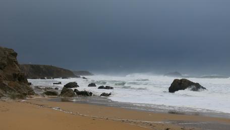 Stormy Coastline with Dramatic Waves and Dark Sky wallpaper