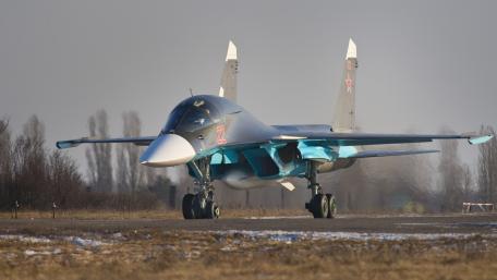 Sleek Military Fighter Jet Ready for Action wallpaper