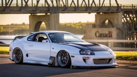 Sleek Performance Car Under a Bridge wallpaper