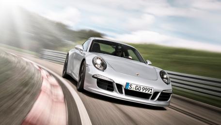 Sleek Silver Sports Car in Motion wallpaper