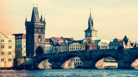 Charming Views of Prague's Iconic Charles Bridge Amidst Historic Architecture wallpaper