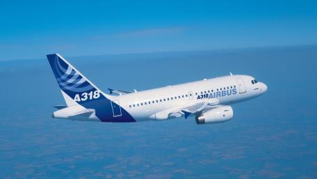 Airbus A318 Flying High Above the Clouds wallpaper