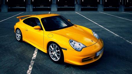 Sleek Yellow Sports Car Wallpaper wallpaper