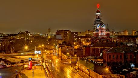Enchanting Night Cityscape with Illuminated Tower wallpaper