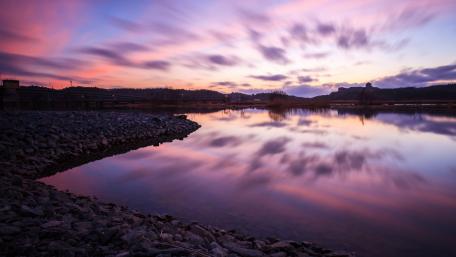 Serene Purple Reflections on a Tranquil Lake wallpaper