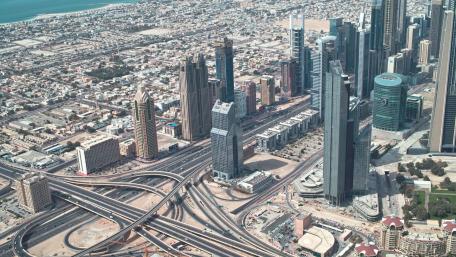 Breathtaking Aerial View of a Modern Cityscape with Skyscrapers and Highways wallpaper